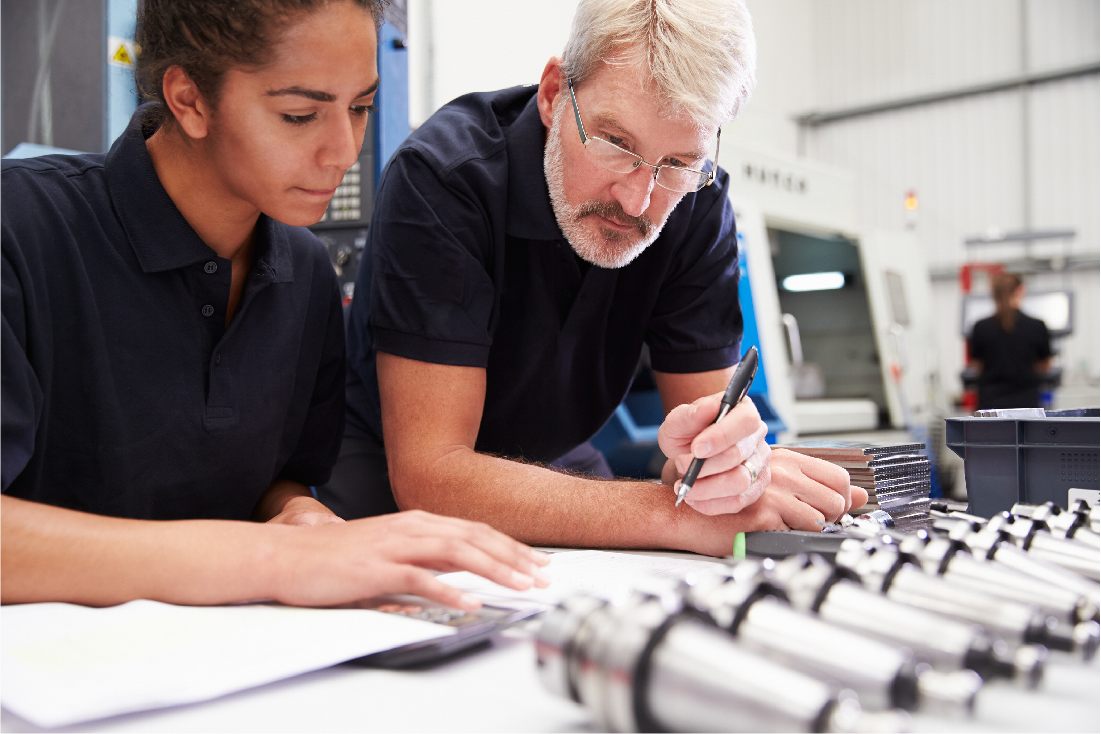 Decorative image of two engineers working